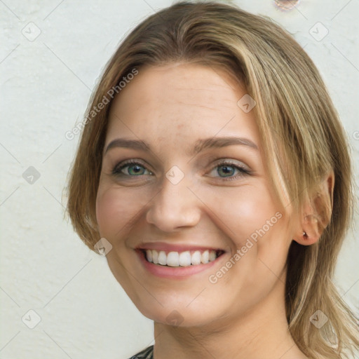 Joyful white young-adult female with long  brown hair and green eyes