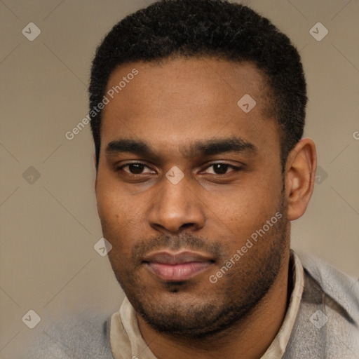 Joyful black young-adult male with short  black hair and brown eyes