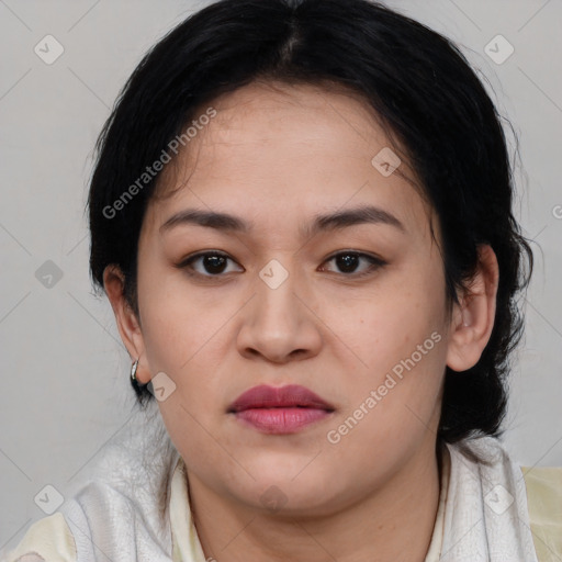 Joyful asian young-adult female with medium  black hair and brown eyes
