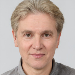 Joyful white adult male with short  brown hair and grey eyes