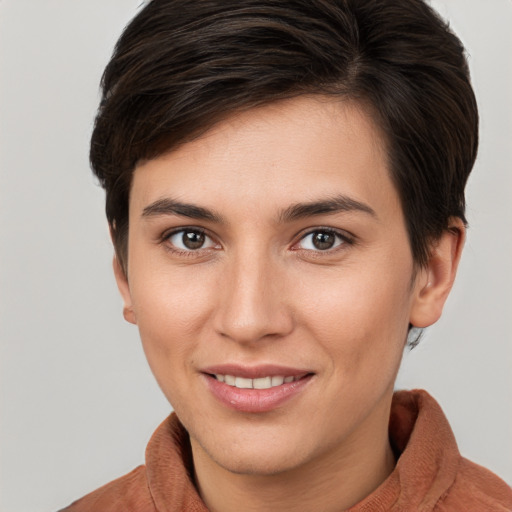 Joyful white young-adult female with short  brown hair and brown eyes