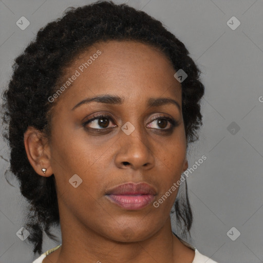 Neutral black young-adult female with medium  brown hair and brown eyes