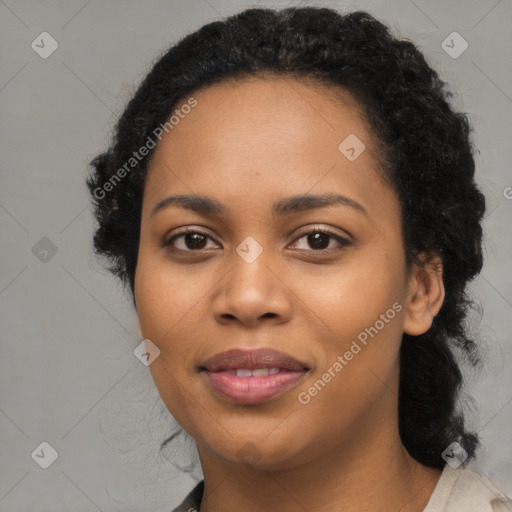 Joyful black young-adult female with medium  brown hair and brown eyes