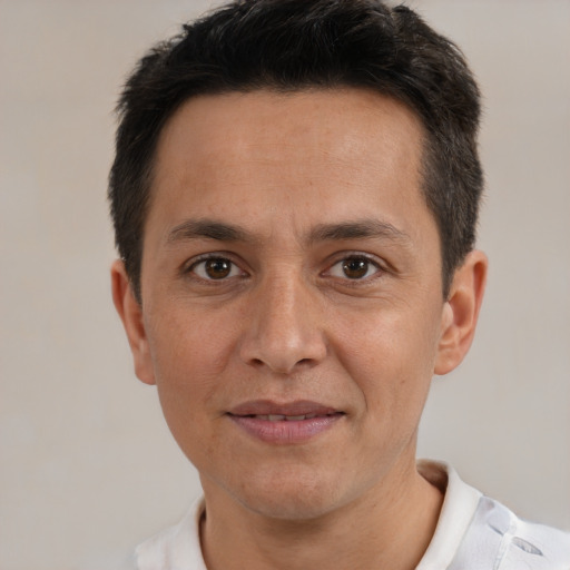 Joyful white adult male with short  brown hair and brown eyes