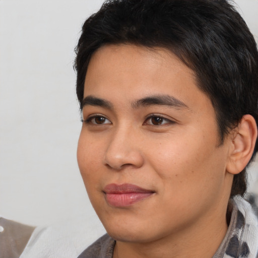 Joyful white young-adult male with medium  black hair and brown eyes