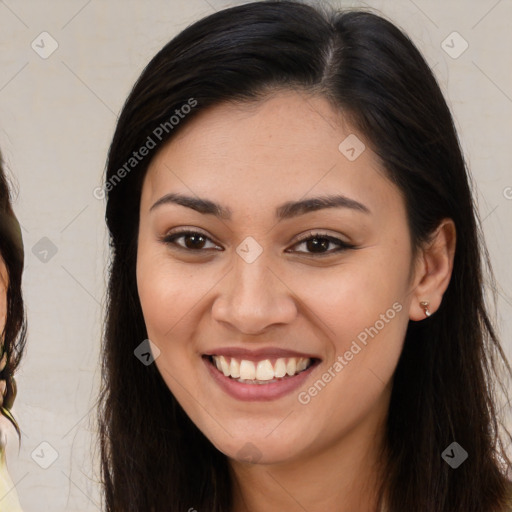 Joyful latino young-adult female with long  brown hair and brown eyes