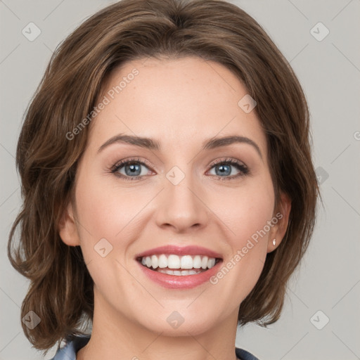 Joyful white young-adult female with medium  brown hair and green eyes