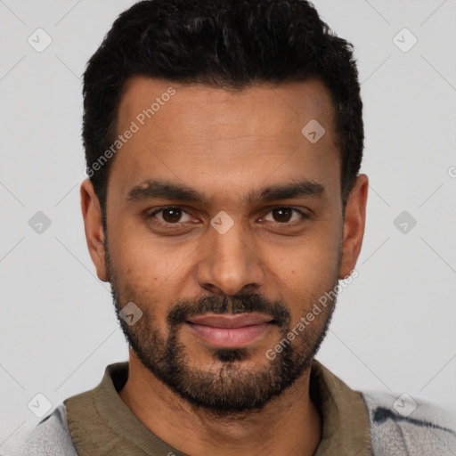 Joyful black young-adult male with short  black hair and brown eyes