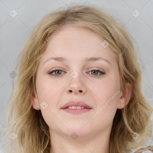 Joyful white young-adult female with medium  brown hair and blue eyes