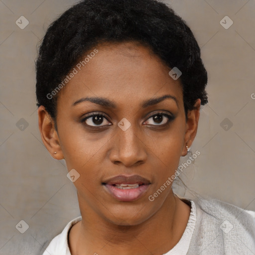 Joyful black young-adult female with short  black hair and brown eyes