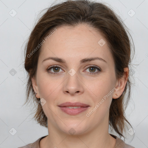 Joyful white young-adult female with medium  brown hair and green eyes