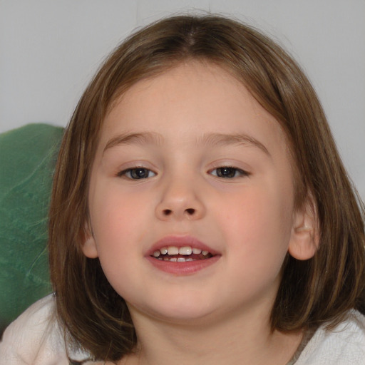 Joyful white child female with medium  brown hair and brown eyes