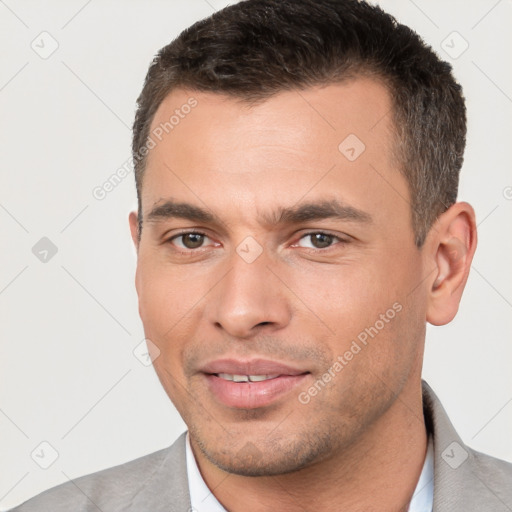 Joyful white young-adult male with short  brown hair and brown eyes