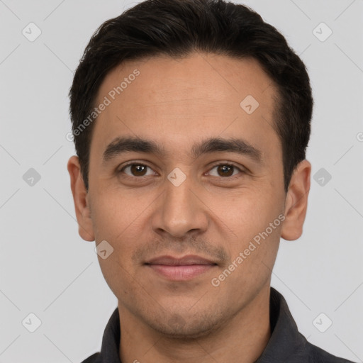 Joyful white young-adult male with short  black hair and brown eyes