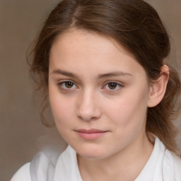 Joyful white child female with medium  brown hair and brown eyes