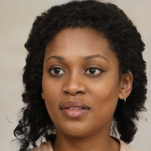 Joyful black young-adult female with medium  black hair and brown eyes