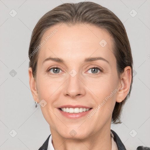 Joyful white adult female with medium  brown hair and grey eyes