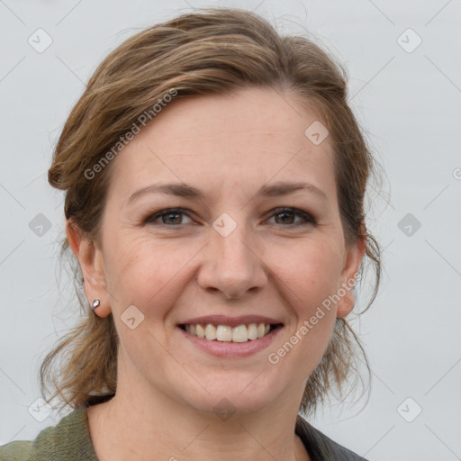 Joyful white adult female with medium  brown hair and grey eyes