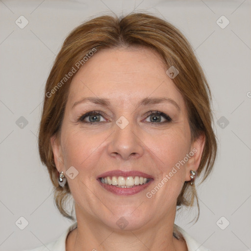 Joyful white adult female with medium  brown hair and blue eyes