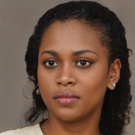 Neutral black young-adult female with long  black hair and brown eyes