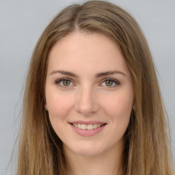 Joyful white young-adult female with long  brown hair and green eyes