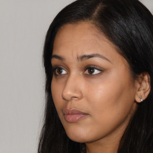 Neutral black young-adult female with long  black hair and brown eyes