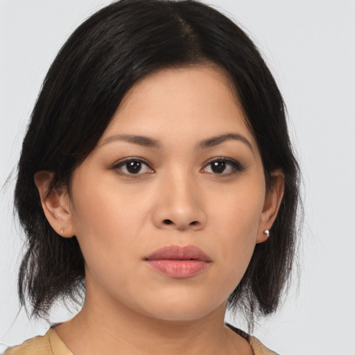 Neutral asian young-adult female with medium  brown hair and brown eyes