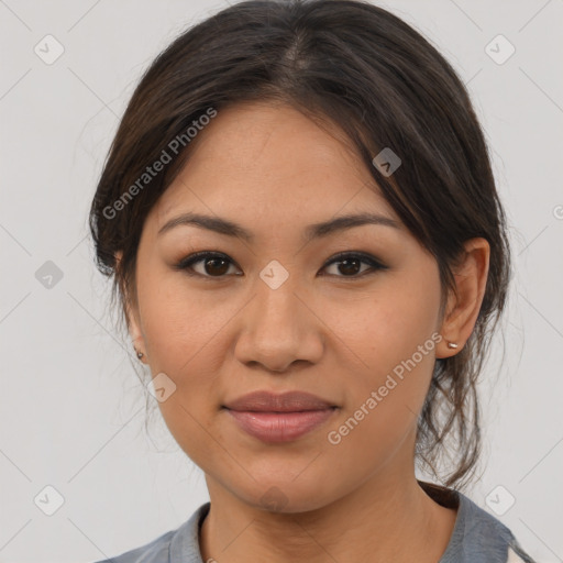 Joyful latino young-adult female with medium  brown hair and brown eyes