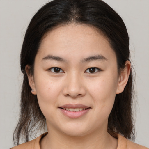 Joyful white young-adult female with medium  brown hair and brown eyes