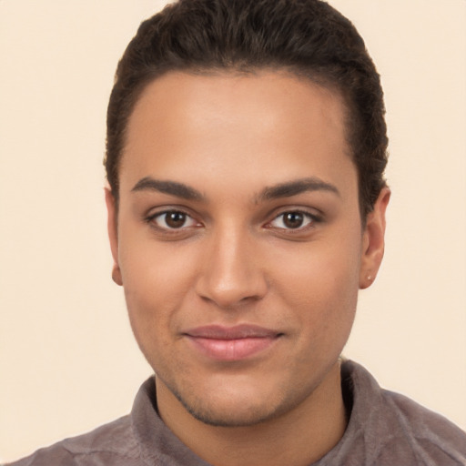 Joyful latino young-adult female with short  brown hair and brown eyes