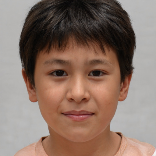Joyful white child male with short  brown hair and brown eyes