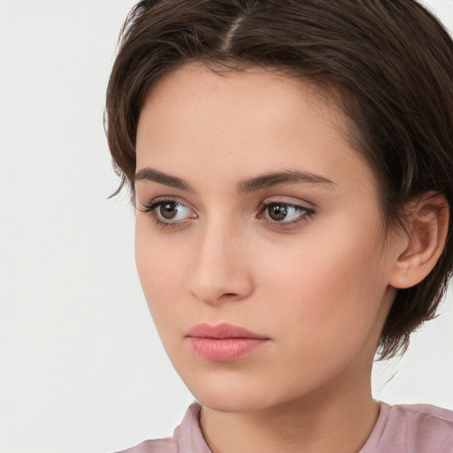 Neutral white young-adult female with medium  brown hair and brown eyes