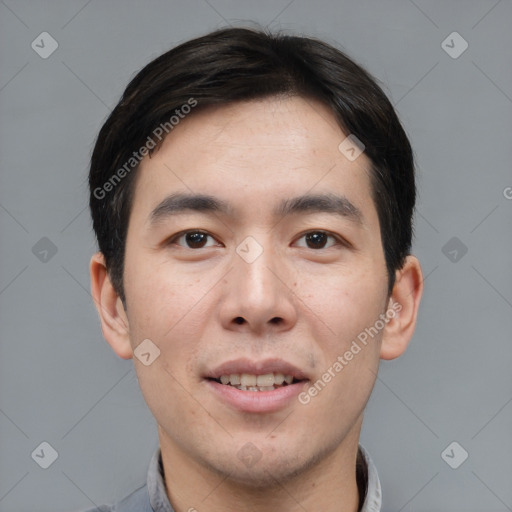 Joyful asian young-adult male with short  brown hair and brown eyes