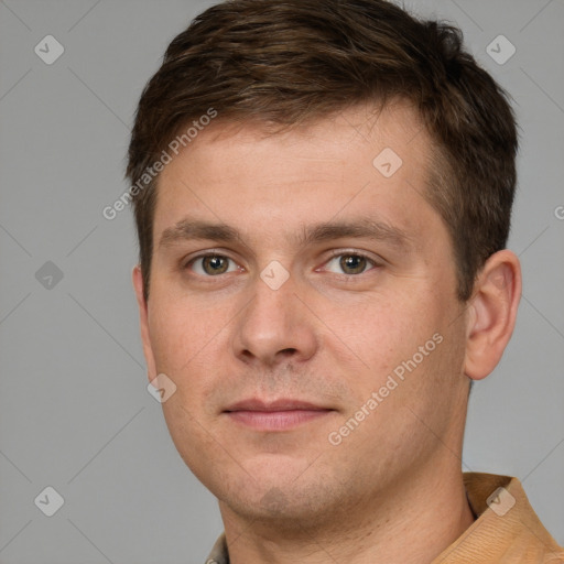 Joyful white young-adult male with short  brown hair and brown eyes