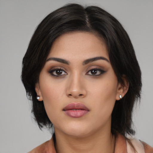 Neutral latino young-adult female with medium  black hair and brown eyes