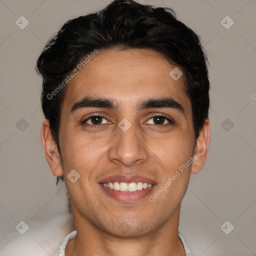 Joyful white young-adult male with short  black hair and brown eyes