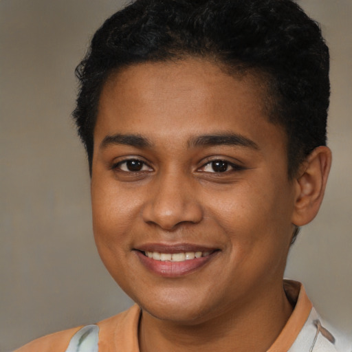 Joyful black young-adult female with short  brown hair and brown eyes