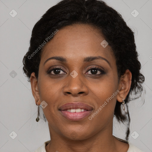 Joyful black young-adult female with medium  brown hair and brown eyes