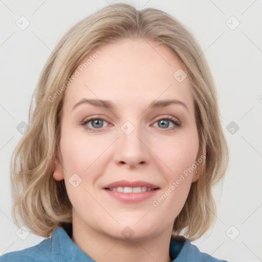 Joyful white young-adult female with medium  brown hair and blue eyes