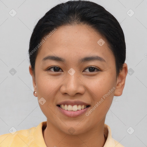 Joyful asian young-adult female with short  brown hair and brown eyes