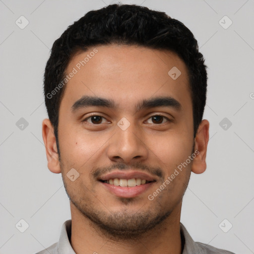 Joyful latino young-adult male with short  black hair and brown eyes