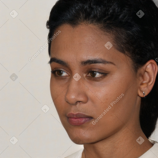 Neutral black young-adult female with short  black hair and brown eyes