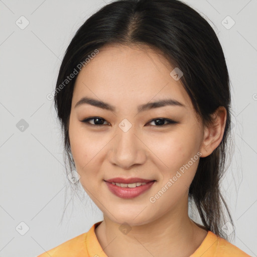 Joyful asian young-adult female with medium  brown hair and brown eyes