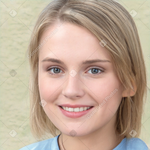 Joyful white young-adult female with medium  brown hair and blue eyes