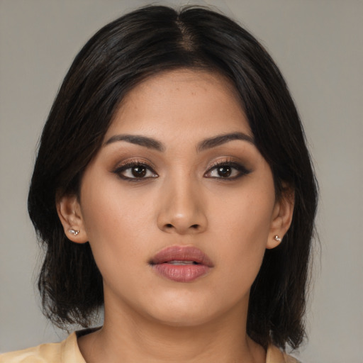 Neutral asian young-adult female with medium  black hair and brown eyes