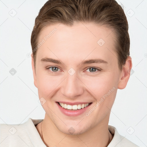 Joyful white young-adult female with short  brown hair and grey eyes