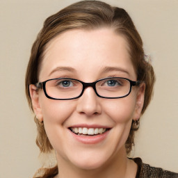 Joyful white young-adult female with medium  brown hair and blue eyes