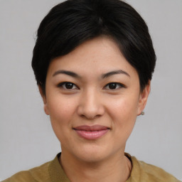 Joyful asian young-adult female with short  black hair and brown eyes