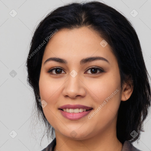 Joyful latino young-adult female with medium  black hair and brown eyes