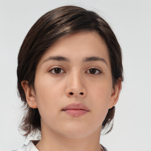 Neutral asian young-adult female with medium  brown hair and brown eyes